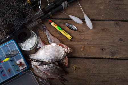 Fishing tackle on wooden backgroundの写真素材