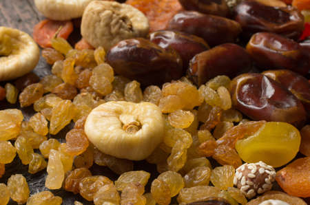 Dried fruits on wooden background
