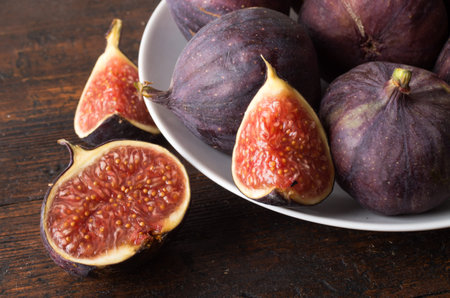 Ripe figs on old wooden table
