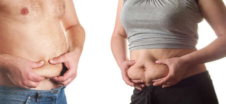 fat woman and man measuring her stomachの写真素材