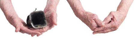 an old tattered wallet in the hands of an old womanの写真素材