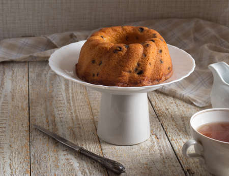 Bundt cake on rustic wooden background