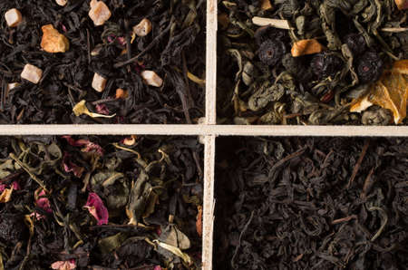 various types of tea on a wooden backgroundの写真素材