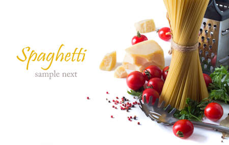 spaghetti and ingredients on a white backgroundの写真素材