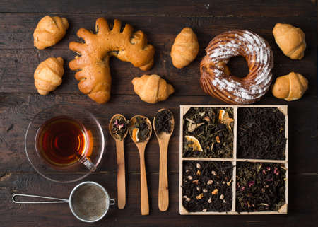 different varieties of tea and pastriesの写真素材