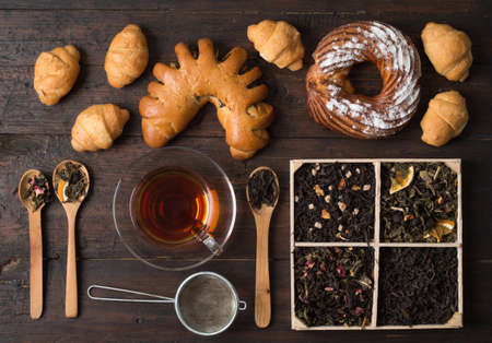 different varieties of tea and pastriesの写真素材