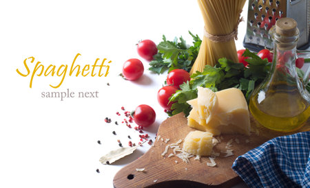 spaghetti and ingredients on a white backgroundの写真素材