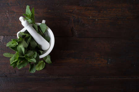 peppermint leaves in a mortarの写真素材