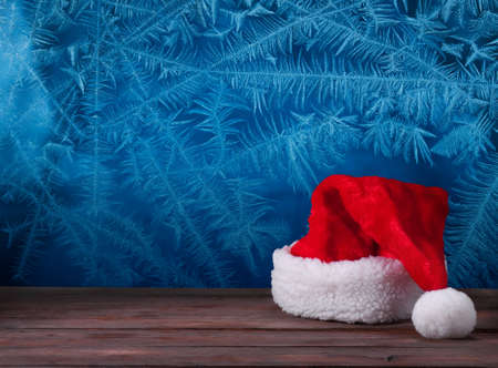 Santa hats on a wooden backgroundの写真素材