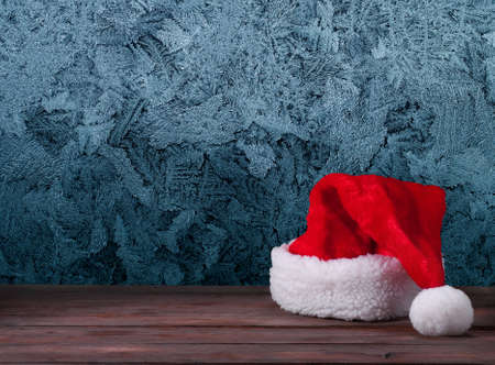 Santa hats on a wooden backgroundの写真素材