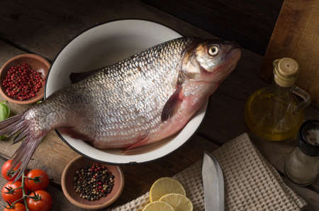 Top view delicious fresh fish and herbs and spices. Still life.