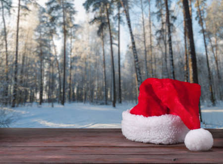 Santa hats on a wooden backgroundの写真素材