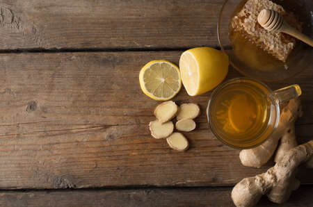 Ginger tea with lemon on a wooden tableの写真素材