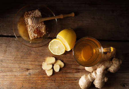Ginger tea with lemon on a wooden tableの写真素材