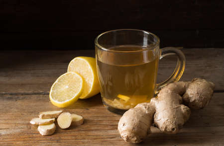 Ginger tea with lemon on a wooden tableの写真素材