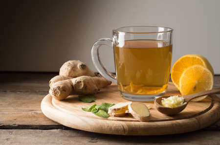 Ginger tea with lemon on a wooden tableの写真素材