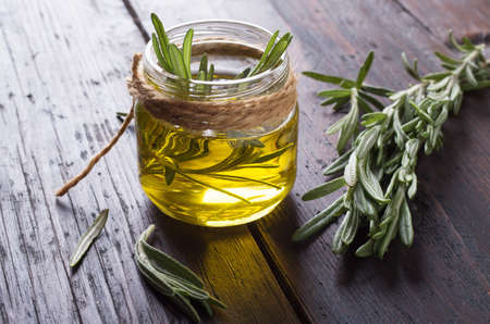 Essential oil of rosemary with fresh green leavesの写真素材