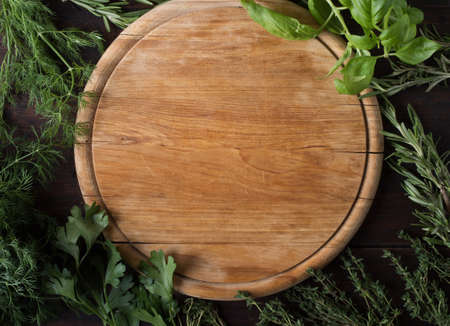 Wooden tray and various herbs.の写真素材
