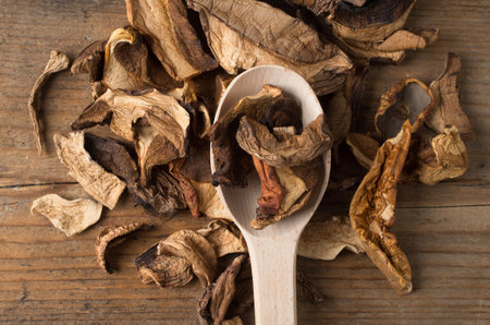 Dried mushrooms on the wooden tableの写真素材