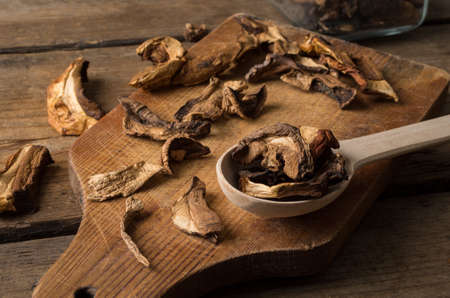 Dried mushrooms on the wooden tableの写真素材