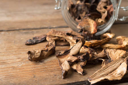 Dried mushrooms on the wooden tableの写真素材