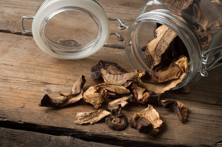 Dried mushrooms on the wooden tableの写真素材