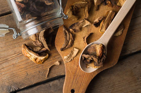 Dried mushrooms on the wooden tableの写真素材