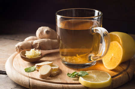 Ginger tea with lemon on a wooden tableの写真素材