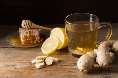 Ginger tea with lemon on a wooden tableの写真素材