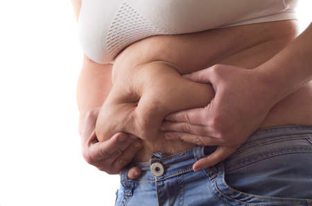 Fat woman isolated over whiteの写真素材