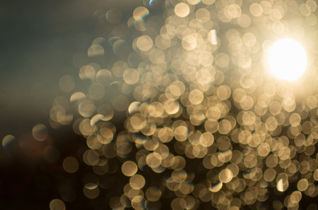gold bokeh abstract background defocused lightsの写真素材
