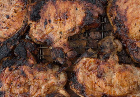 Tasty marinated t-bone steak barbecuing