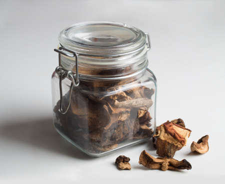 Sliced dried mushrooms on white backgroundの写真素材