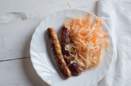 Bavarian fried sausages on sauerkraut