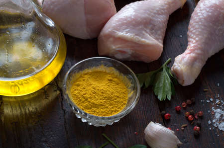 Raw fresh chicken legs on wooden backgroundの写真素材