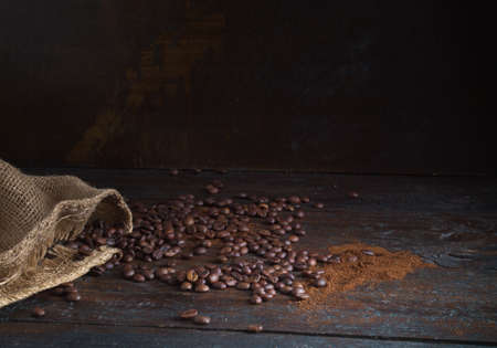 Coffee beans on wood background