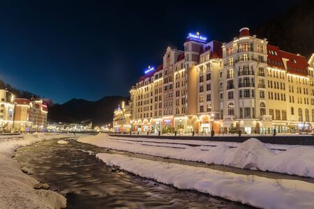 Russia, Sochi, Krasnaya Polyana. The resort of Rosa Khutor, hotels and shops at the Mzymta River at...