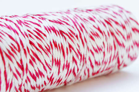 Red and white rope, tied tie multipurpose items seized or sticky material.