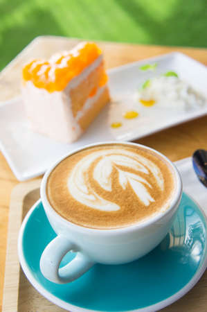coffee cup and Delicious cake in coffee shop