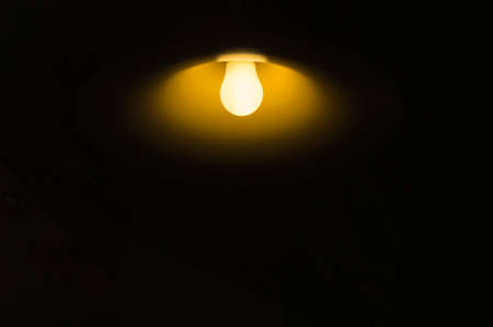 Light bulbs in the dark roomの写真素材