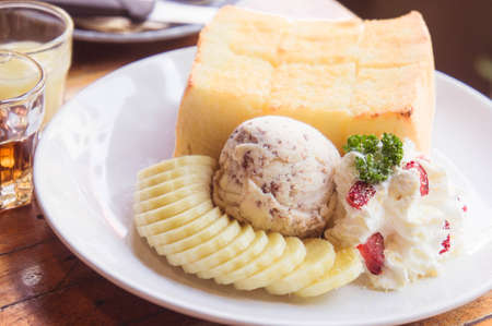 Toast and ice cream and banana dessert in cafeの写真素材