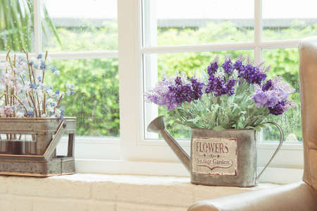 Flower pot in the window vintage styleの写真素材
