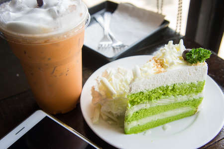 Cold milk thai tea and cake