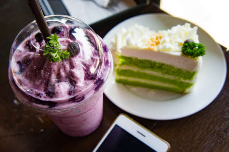 Blueberry Smoothie , and cake relax time  in the cafeの写真素材