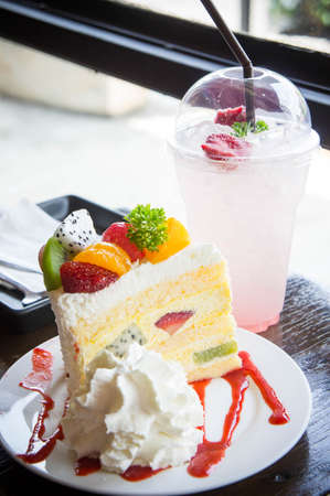 fruit cake muffin dessert and sweet beverage in cafeの写真素材