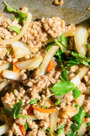 Basil Fried Pork Chops Cooking on a hot pan. Popular food of Thailand and is known worldwide.の写真素材