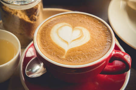 coffee red cup and tasty cake in the cafe vintage coffee timeの写真素材