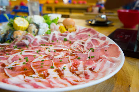 Shabu pork meat slides , Shabu style cooking in restaurantの写真素材