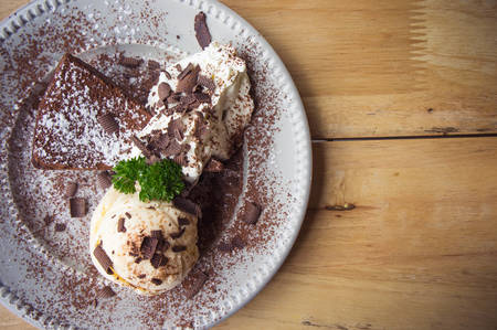 ice cream Vanilla chocolate pie whippin creamy tasty dessert on wood table in cafe ready to eat in...