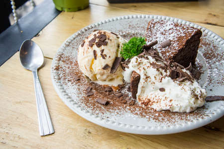 ice cream Vanilla chocolate pie whippin creamy tasty dessert on wood table in cafe ready to eat in restaurantの写真素材